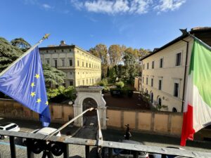 Outside photo of Accademia Nazionale dei Lincei in Rome and the Italian and European flags
